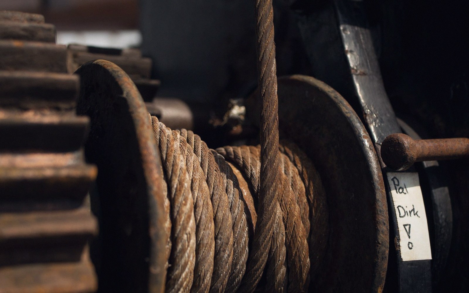 A descender drum and line on a rigging deck, cable spooled